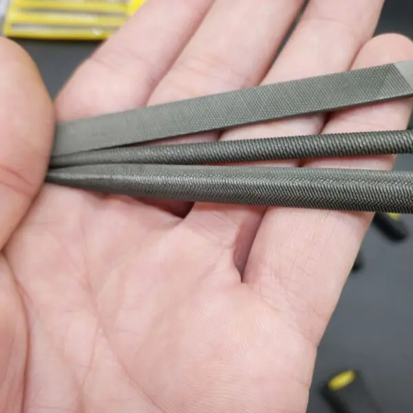 More clear steel file in hands